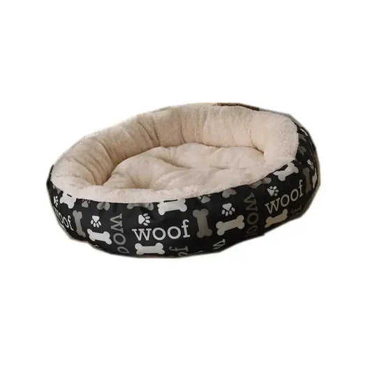Cosy Round Donut Cat Dog Bed featuring a soft plush interior and stylish black exterior with bone patterns.