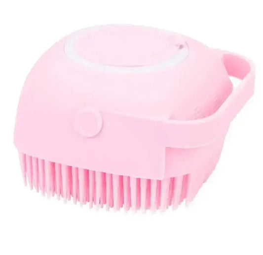 Dog Shampoo Brush in pink with soft silicone bristles for pet bathing and grooming.