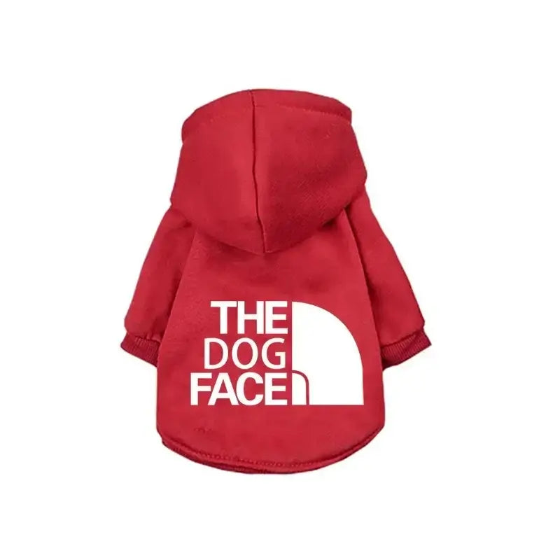The Dog Face Hoodie in red, featuring a stylish logo, perfect for keeping dogs warm and comfortable.