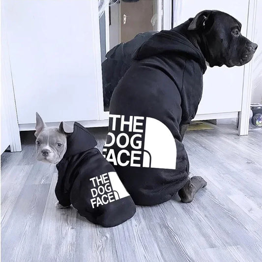 Two dogs wearing The Dog Face Hoodie, showcasing cozy style for small and large pets.